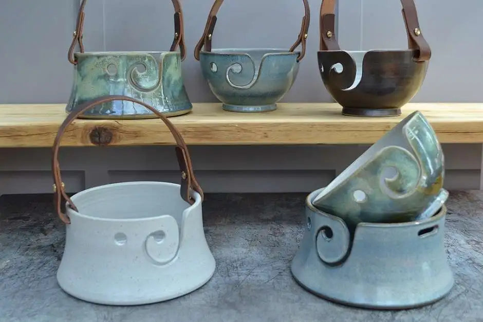 Unique handmade Stoneware Pottery yarn bowls  with our distinctive and much-loved leather handles in a variety of designs and colours. 